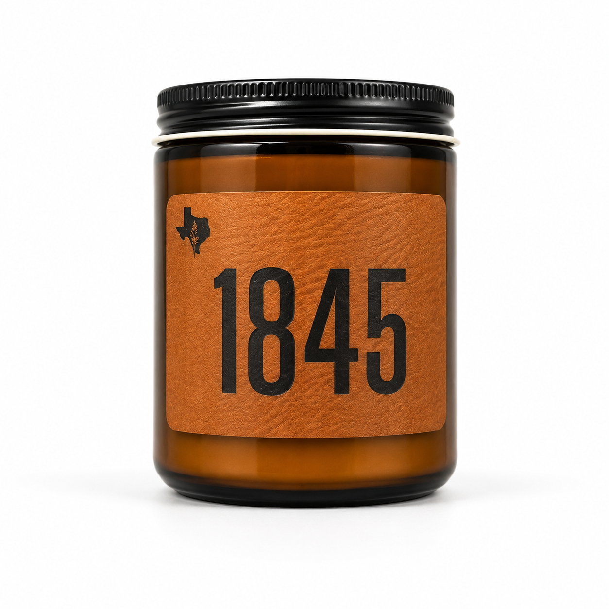 The 1845 8oz soy candle in an amber glass jar with a black lid and a leather label reading '1845', hand-poured by Texas Candles.